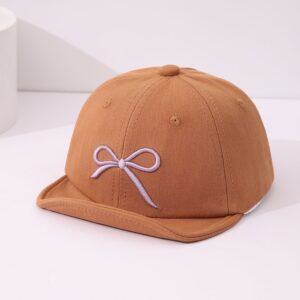 Kinderstijl Zachte stoffen strikdecoratie Koepelvormige baseballpet met een schattige en zachte kinderlijke stijl, geschikt voor lente- en zomerkleding.